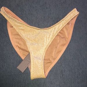 Normal size swimsuit bottoms brown lining.